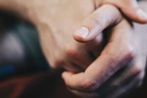 Hands clasped together,
